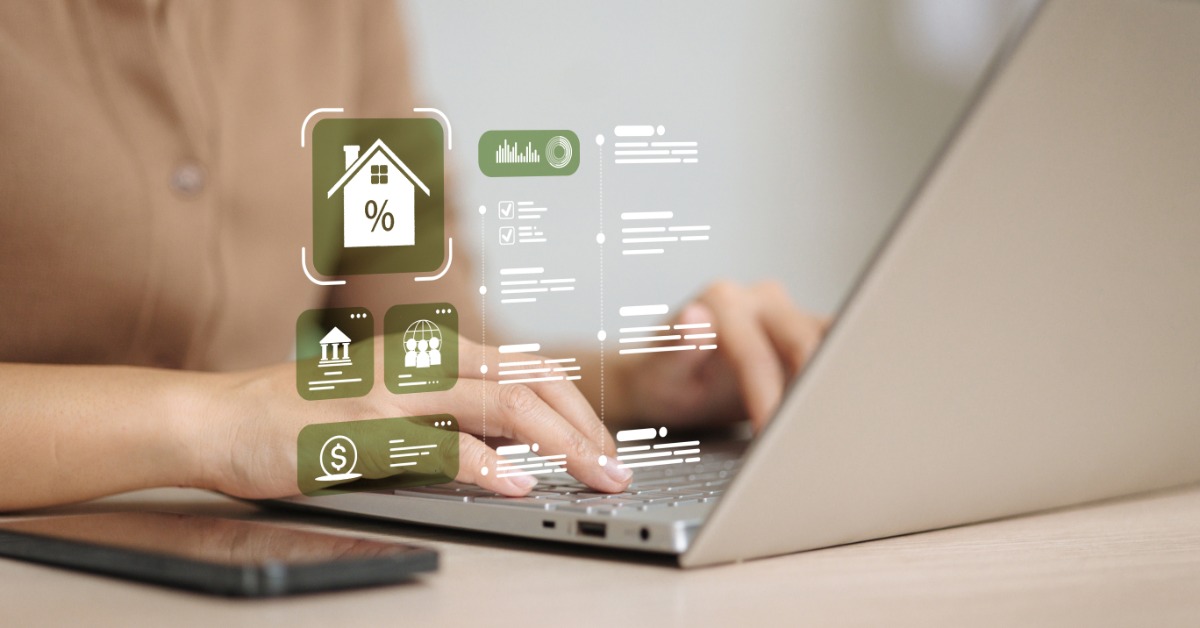 A person types on a laptop. Digital icons show a house, a percentage symbol, a dollar sign, and financial graphics.