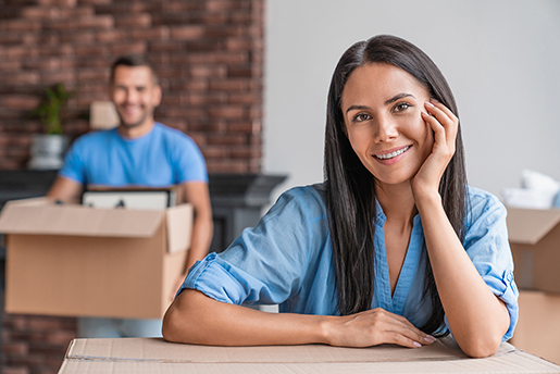 Couple unloading boxes in rental home